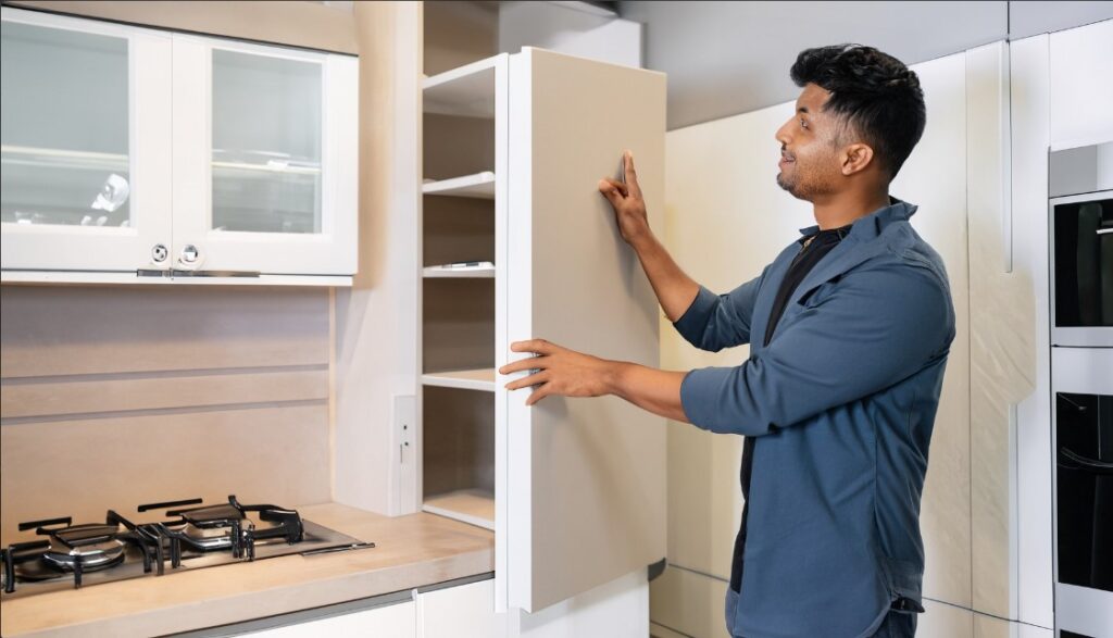 Person choosing kitchen cabinet designs